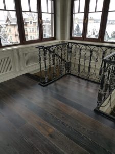 Mansion with black oak flooring.