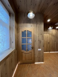 Walls and ceiling finished with light-toned oak.