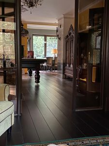 Villa with underfloor heating and black oak flooring.