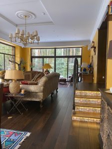 Villa with underfloor heating and black oak flooring.