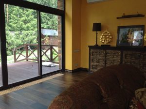Villa with underfloor heating and black oak flooring.