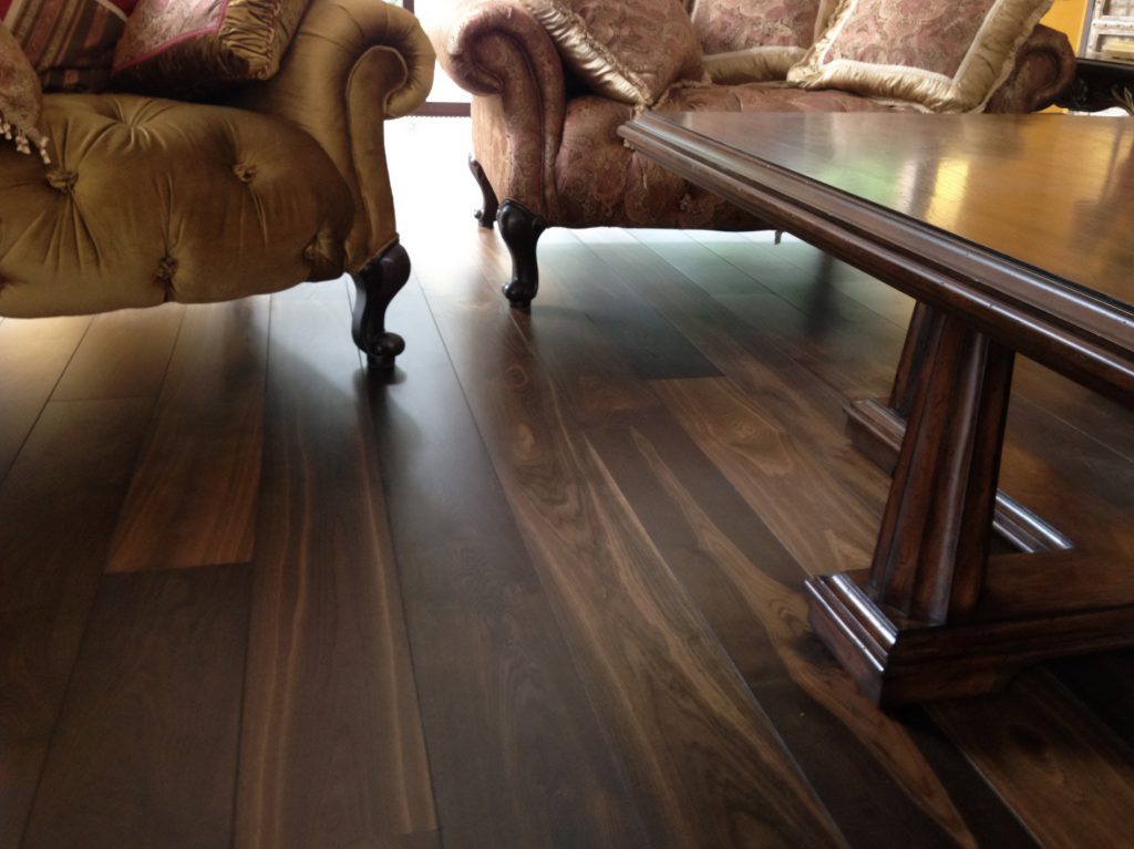 Villa with underfloor heating and black oak flooring.